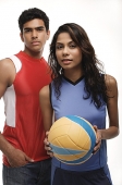 Young couple with beach ball looking at camera - Asia Images Group