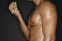 muscular man with apple - Alex Mares-Manton