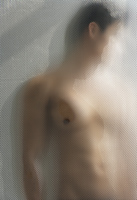 muscular man behind shower glass - Alex Mares-Manton