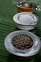 Ingredients for natural body scrubs and body treatments (seeds, sea salt, papaya) - Nugene Chiang