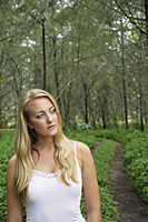 Blond woman on wooded path, wearing white - Alex Mares-Manton