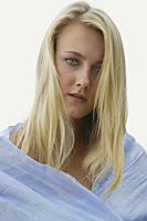 Portrait of serious blond woman, wearing blue shawl - Alex Mares-Manton