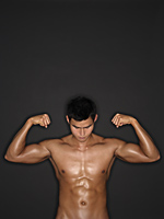 muscular man flexing muscles - Alex Mares-Manton