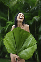 naked woman behind big tropical leaf - Alex Mares-Manton