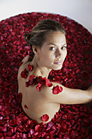 woman in bathtub with petals - Alex Mares-Manton