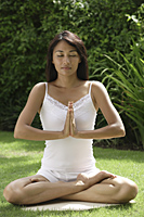 woman practicing yoga outside - Cedric Lim