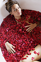 woman in bathtub with petals - Alex Mares-Manton