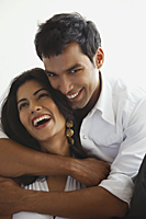 couple wearing all white, embracing - Vivek Sharma