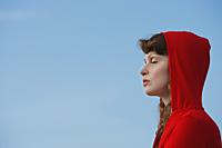 Profile of woman in red hoodie - Alex Mares-Manton