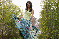 Woman twirling in skirt - Vivek Sharma