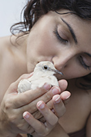 woman kissing dove - Alex Mares-Manton