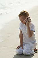 boy listening to seashell - Alex Mares-Manton
