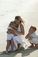 woman with children at beach - Alex Mares-Manton