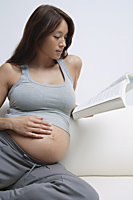 Pregnant woman reading - Alex Mares-Manton