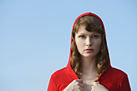 Red haired woman in red jacket and hoodie - Alex Mares-Manton