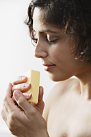 Woman smelling soap - Alex Mares-Manton