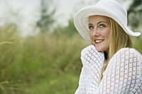 Blond woman wearing white hat, eyes looking up - Alex Mares-Manton