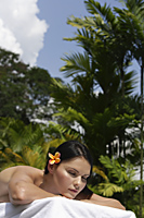 woman lying on towel in tropics - Alex Mares-Manton