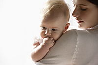 Baby girl over mother's shoulder - Alex Mares-Manton