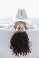 Woman lying on back, hair draped down - Alex Mares-Manton