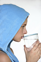Profile woman in blue hooded vest, drinking water - Alex Mares-Manton