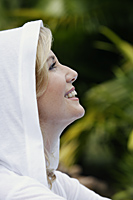 Profile of woman in white hooded sweatshirt - Alex Mares-Manton