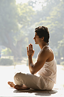 Profile of man in yoga posture - Alex Mares-Manton