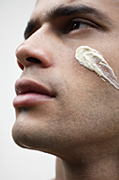 Man with facial scrub on cheek - Alex Mares-Manton