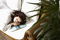 Woman asleep, head on book - Alex Mares-Manton