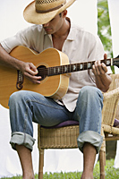 Man playing guitar - Alex Mares-Manton