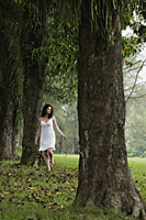 woman walking through forest - Alex Mares-Manton