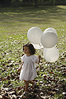 Girl in park, with balloons - Alex Mares-Manton