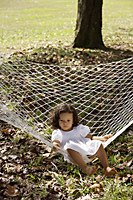Girl sitting in hammock - Alex Mares-Manton