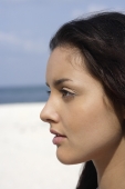 profile of young woman on beach - Nugene Chiang