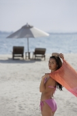 woman on beach wearing pink bikini - Alex Mares-Manton