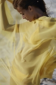 woman in yellow bikini wrapped in yellow fabric - Alex Mares-Manton