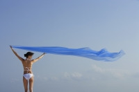 woman in bikini with flowing blue fabric - Alex Mares-Manton