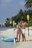 couple on beach with kayak - Alex Mares-Manton