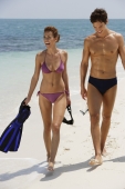 young couple walking up beach - Alex Mares-Manton