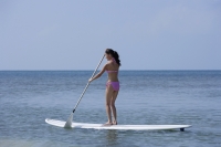 woman on surf board in ocean - Alex Mares-Manton