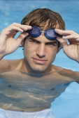 young man in pool with goggles - Alex Mares-Manton