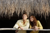 Young couple on balcony - Alex Mares-Manton