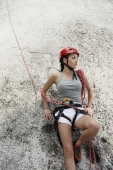 woman finished rock climbing or repelling - Nugene Chiang