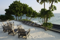 chairs on sand facing ocean - Alex Mares-Manton