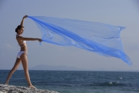 woman in bikini with flowing blue fabric - Alex Mares-Manton