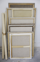 stacks of canvases leaning against wall - Alex Mares-Manton