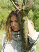Young woman leaning against tree branch - Alex Hajdu