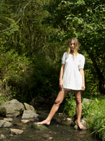 Young woman standing in stream - Alex Hajdu