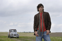 Young man standing near car - Alex Mares-Manton