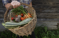 man holding basket of vegetables - Alex Mares-Manton